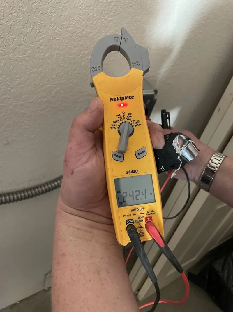 Voltage testing with clamp meter during Circuit Breaker Repair in Cullman